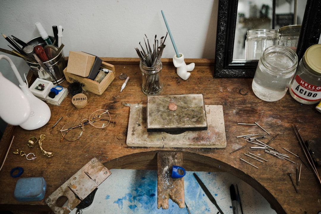 black and blue paint brush on brown wooden chopping board - Photo by Thandy Yung on Unsplash
